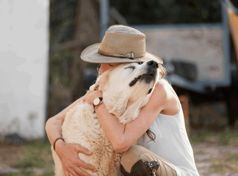 Woman sharing a tender moment with their rescue pet, showing how pets rescue us right back with love and healing